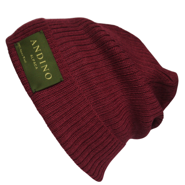 Burgundy alpaca wool beanie hat from the side on a white background