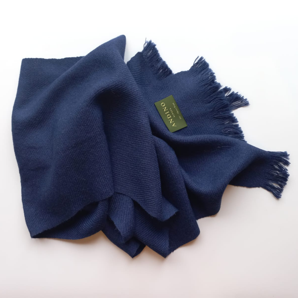 Burgundy large alpaca wool scarf shawl folded on white background with Andino Alpaca logo print.