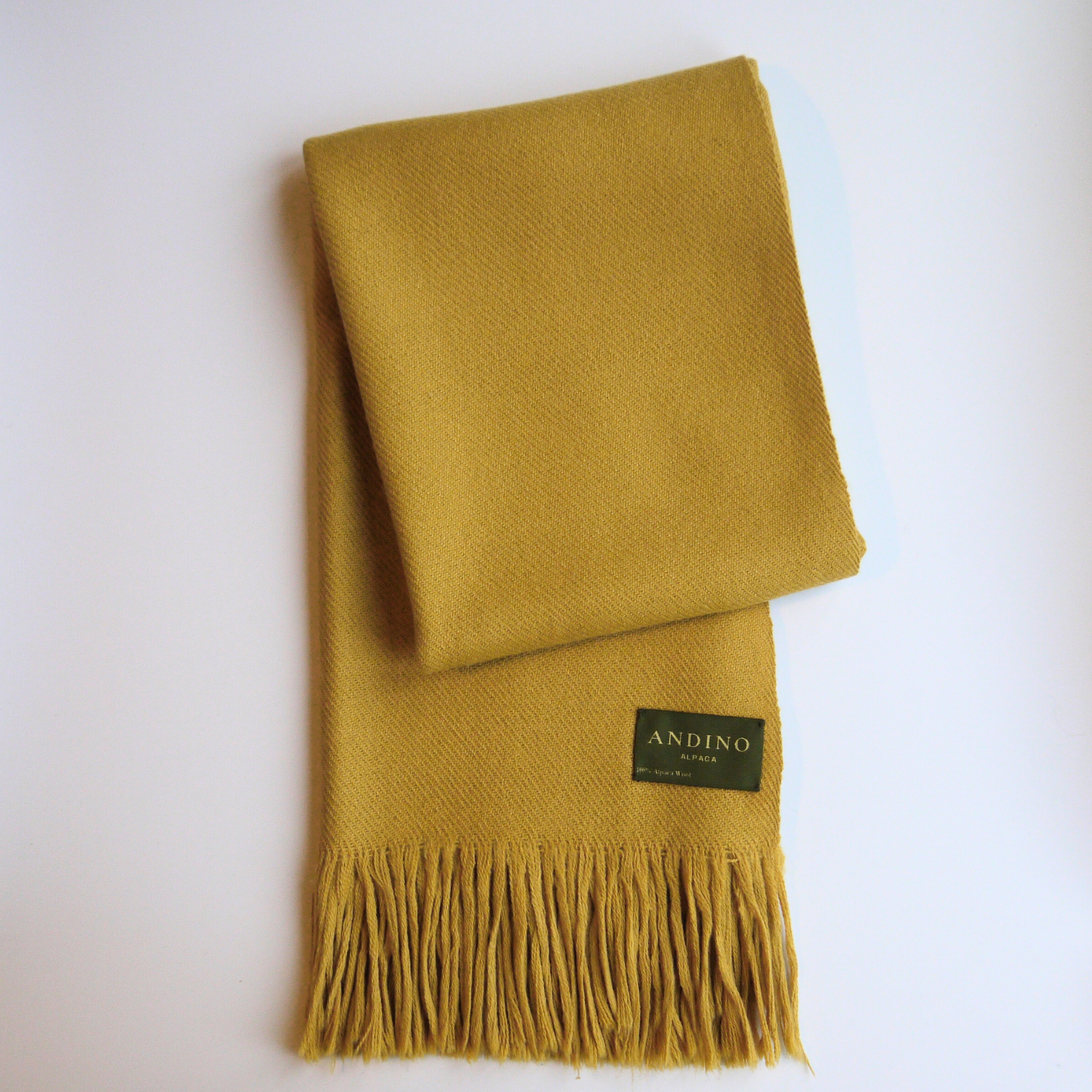 Camel colour alpaca wool scarf extra large & long slightly unfolded on white background with Andino Alpaca logo print.