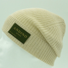 Cream alpaca wool beanie hat from the side on a white background