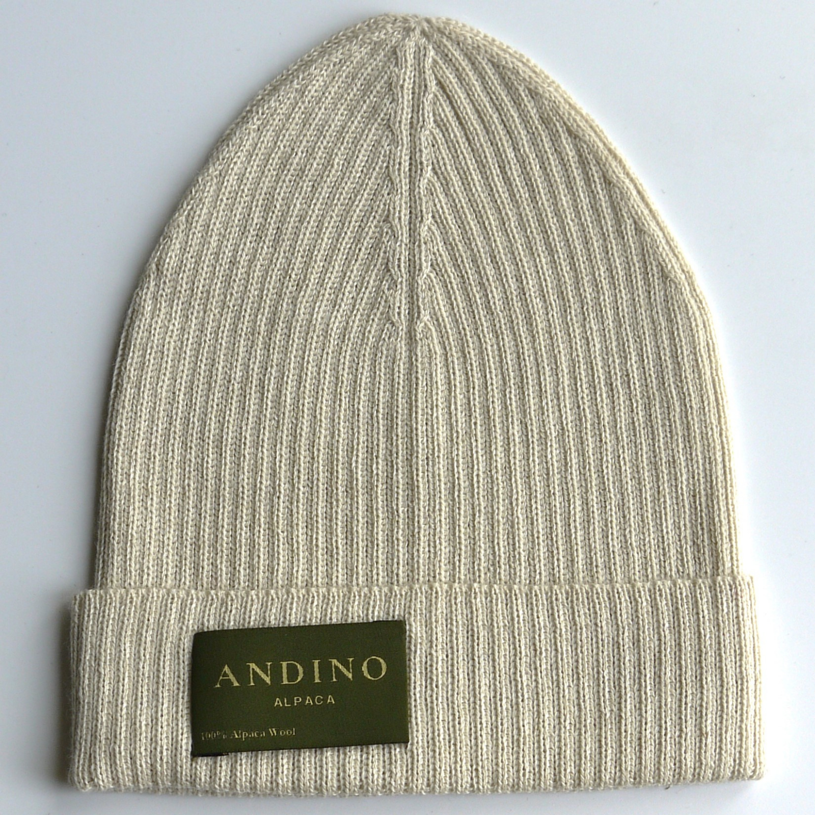Cream alpaca wool beanie hat on a white background