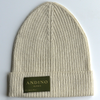 Cream alpaca wool beanie hat on a white background
