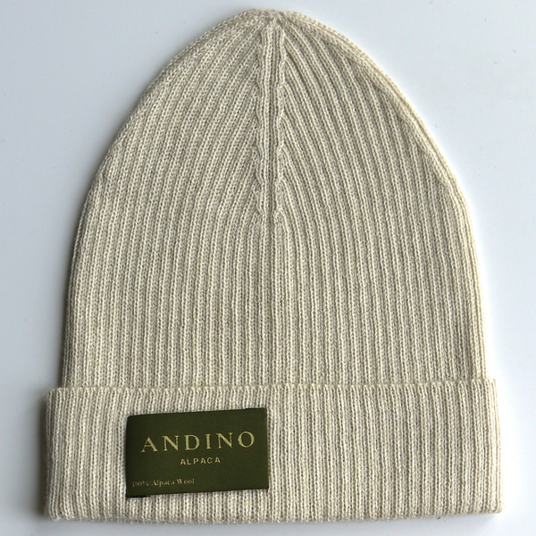 Cream alpaca wool beanie hat on a white background