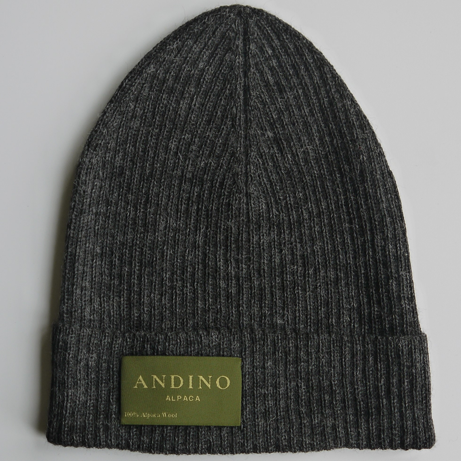 Dark grey alpaca wool beanie hat on a white background