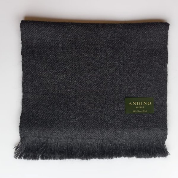Dark grey large alpaca wool scarf shawl unfolded on white background with Andino Alpaca logo print.