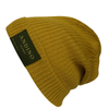 Mustard alpaca wool beanie hat on a white background.