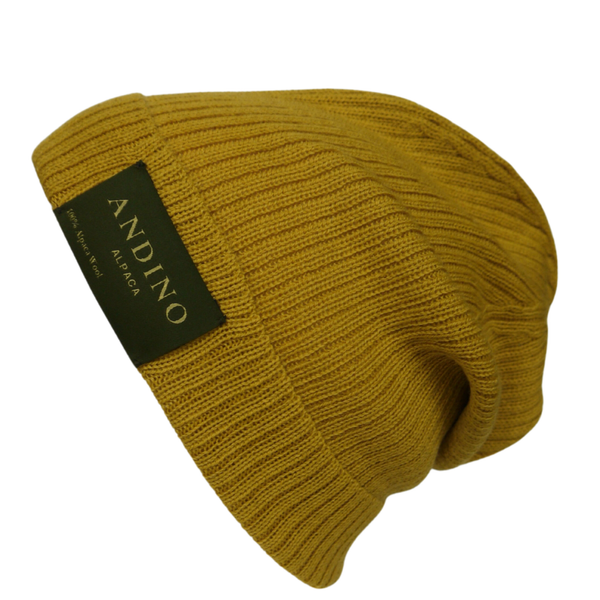 Mustard alpaca wool beanie hat on a white background.