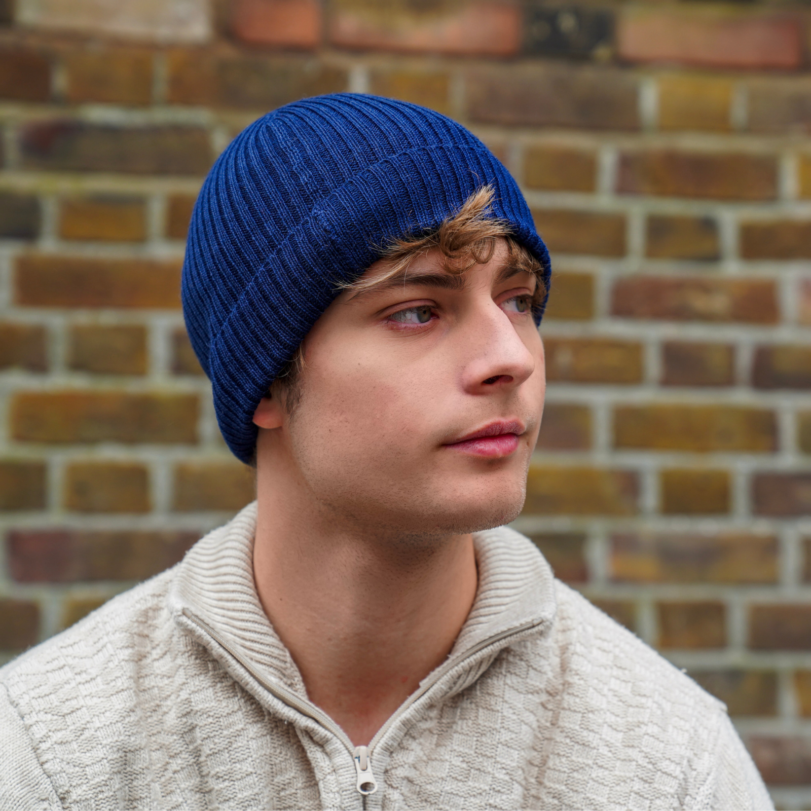 Mustard alpaca wool beanie hat on a white background