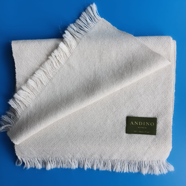 Mustard large alpaca wool scarf shawl folded on a white background.