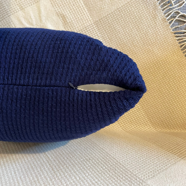Navy blue Alpaca cushion cover zoomed in with zipper and slightly uncovered