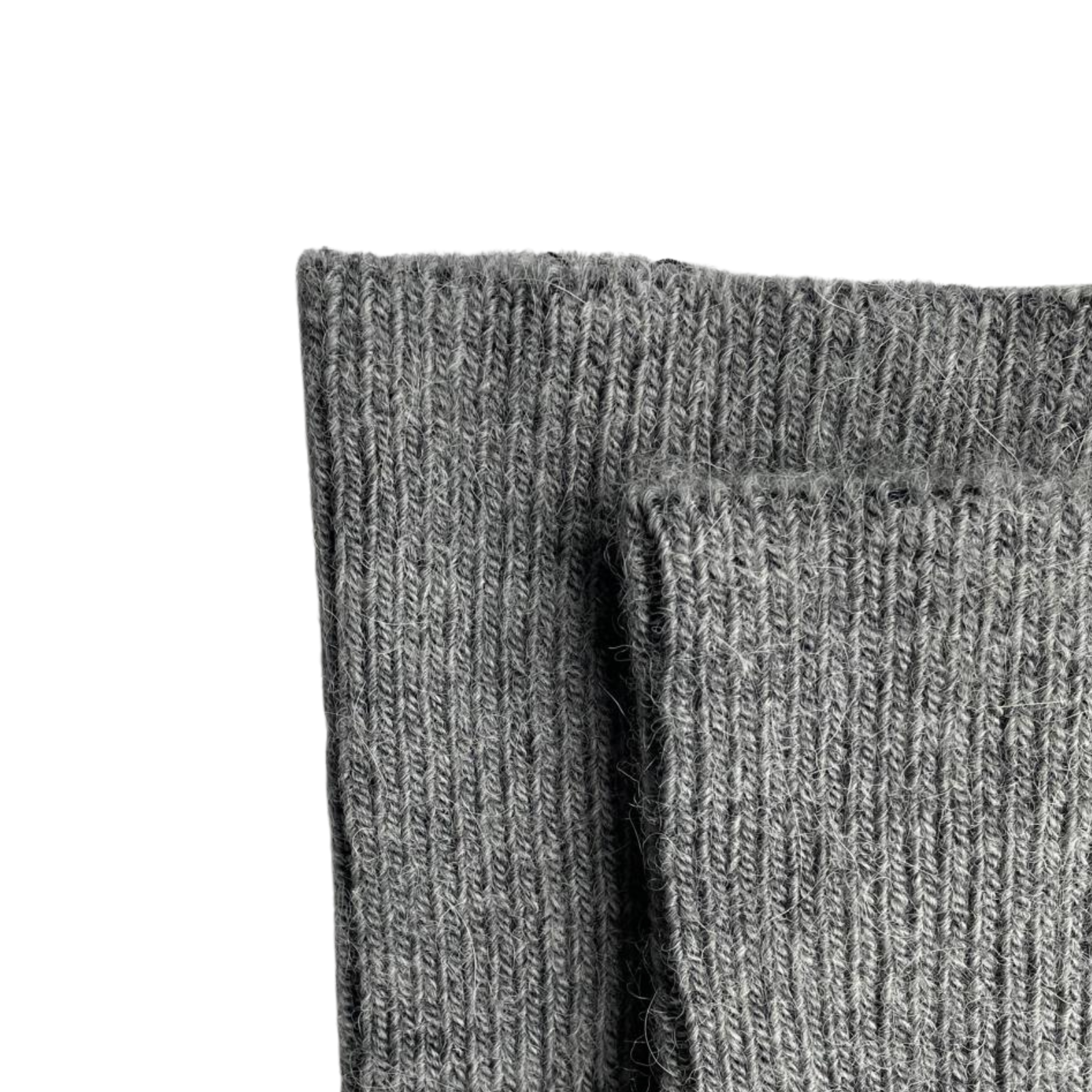 Pair of zoomed-in light grey alpaca socks on a white background.
