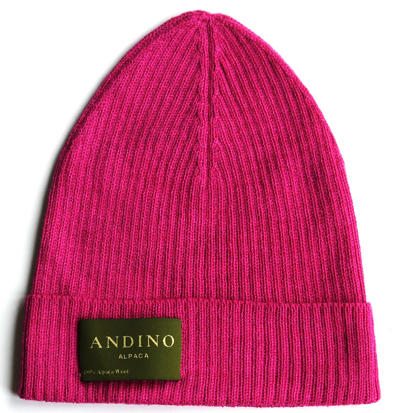 Pink alpaca wool beanie hat from the side on a white background