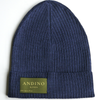 Pink alpaca wool beanie hat on a white background