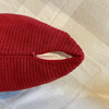 Red Alpaca cushion cover zoomed in with zipper and slightly uncovered