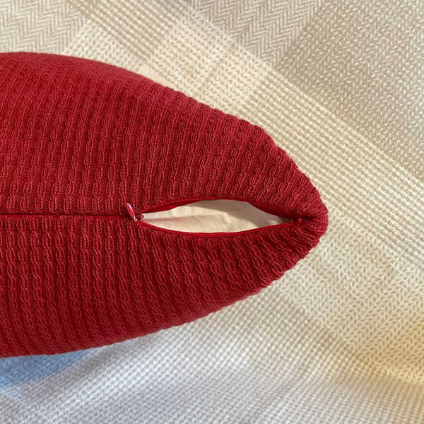 Red Alpaca cushion cover zoomed in with zipper and slightly uncovered