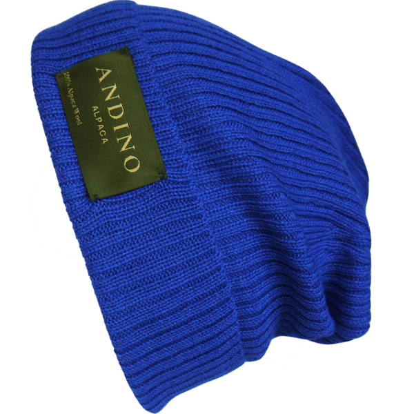 Royal blue alpaca wool beanie hat from the side on a white background